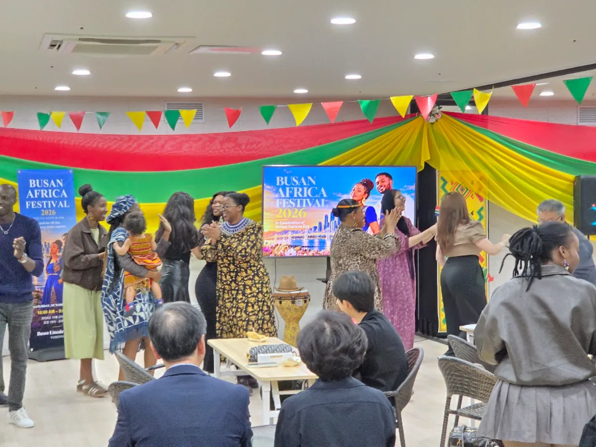 Festival participants join together in dancing, bringing the event's message of cultural exchange, friendship, and shared celebration to life.